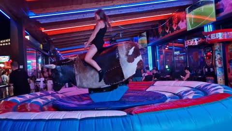 GIRL TAKE ON THE BULL! Benidorm Bull Ride. Mechanical Bull EPIC FAIL