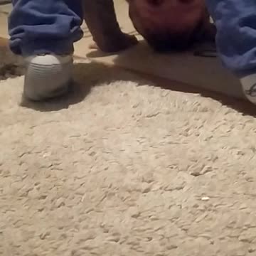 Baby is looking upside down