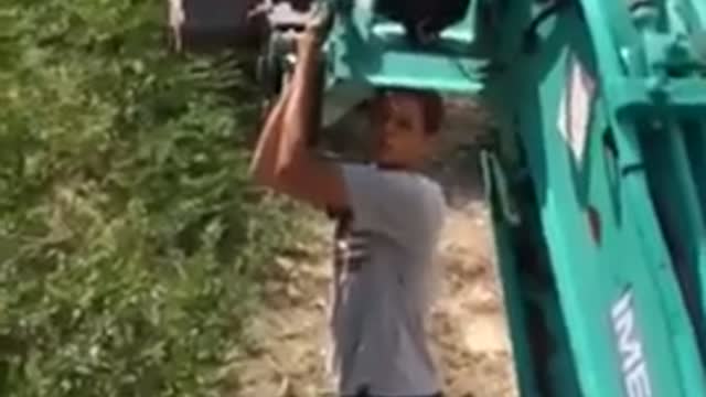 Young man on a backhoe loader