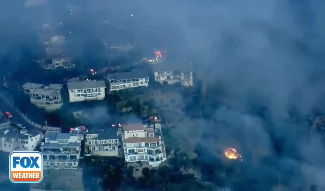 BREAKING! High winds are fueling a brush fire in Laguna Beach, California.