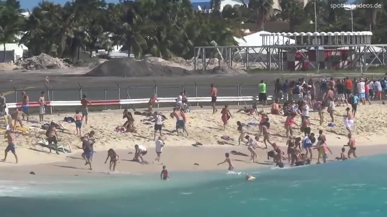 KLM 747 Extreme Jet Blast blowing People away atMaho Beach, St. Maarte