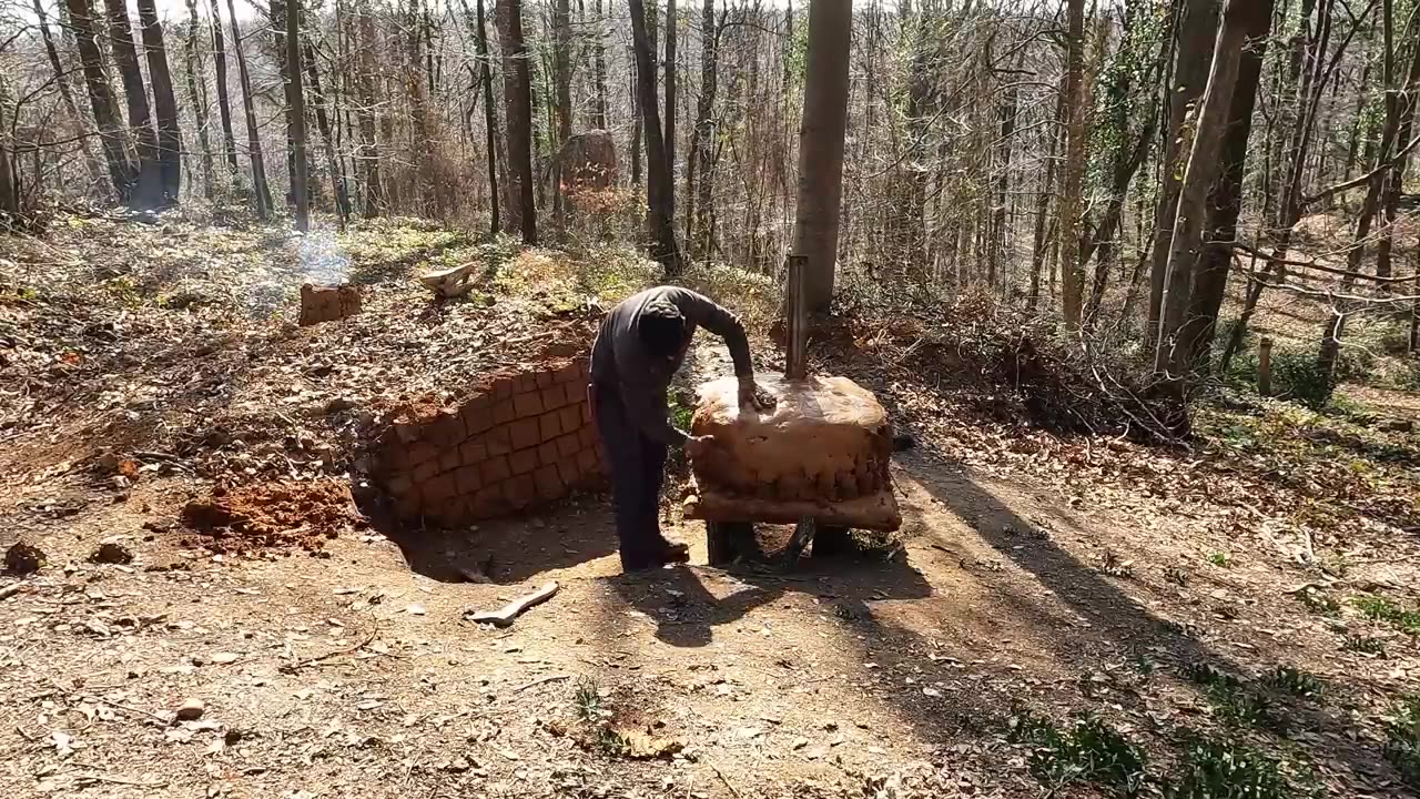 Survival, building an underground shelter in the forest, making a stove