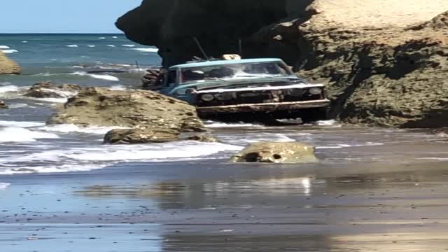 Load Carrying Truck Emerges from Ocean