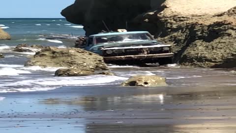 Load Carrying Truck Emerges from Ocean