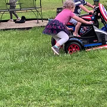 Small white man drags crazy purple haired feminist behind his motorcycle
