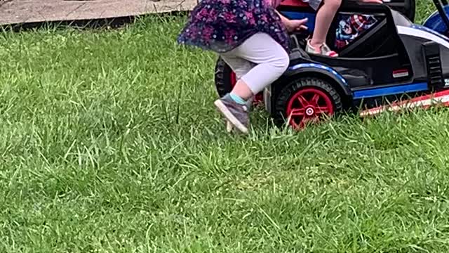 Small white man drags crazy purple haired feminist behind his motorcycle