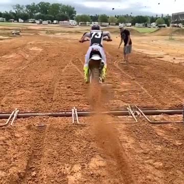 Flying dirt directly into the camera from a motorcycle