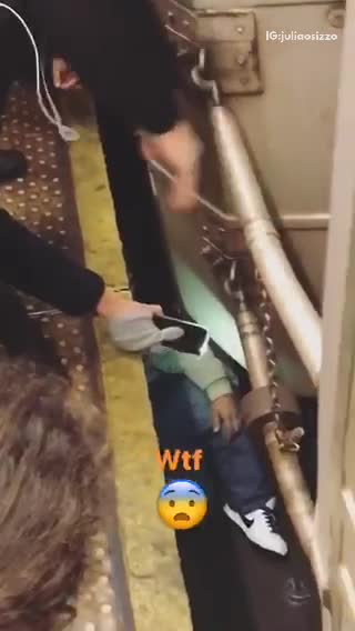 Wtf guy stuck under subway tracks under train