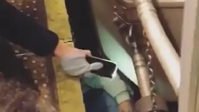 Wtf guy stuck under subway tracks under train