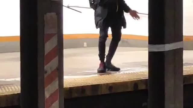 Subway goer dances to the voice of the lady speaking on subway intercom