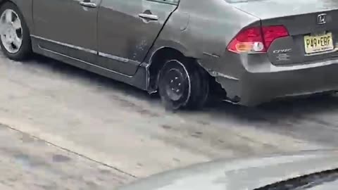 Car Drives Along Interstate on the Rim