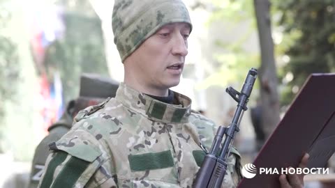 Former Ukrainian soldiers take oath to fight for Russia