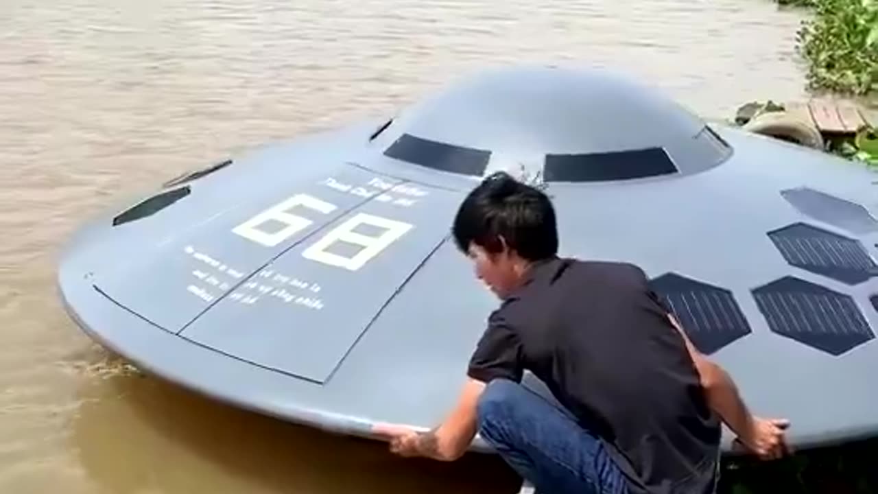 A Vietnamese YouTuber Thánh Chế casually launching his UFO shaped boat into the river