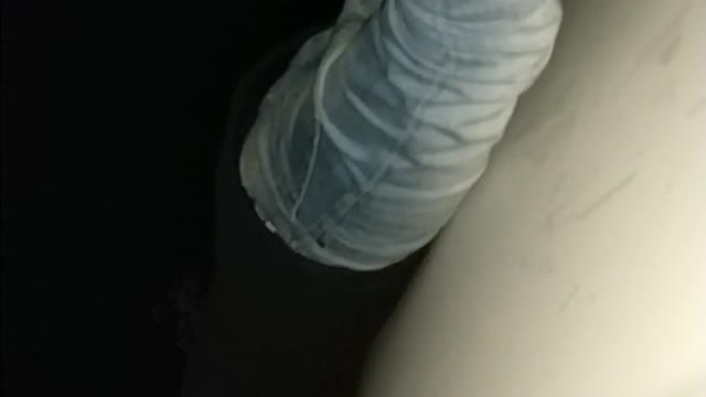 Music guy rides on top of white car at night