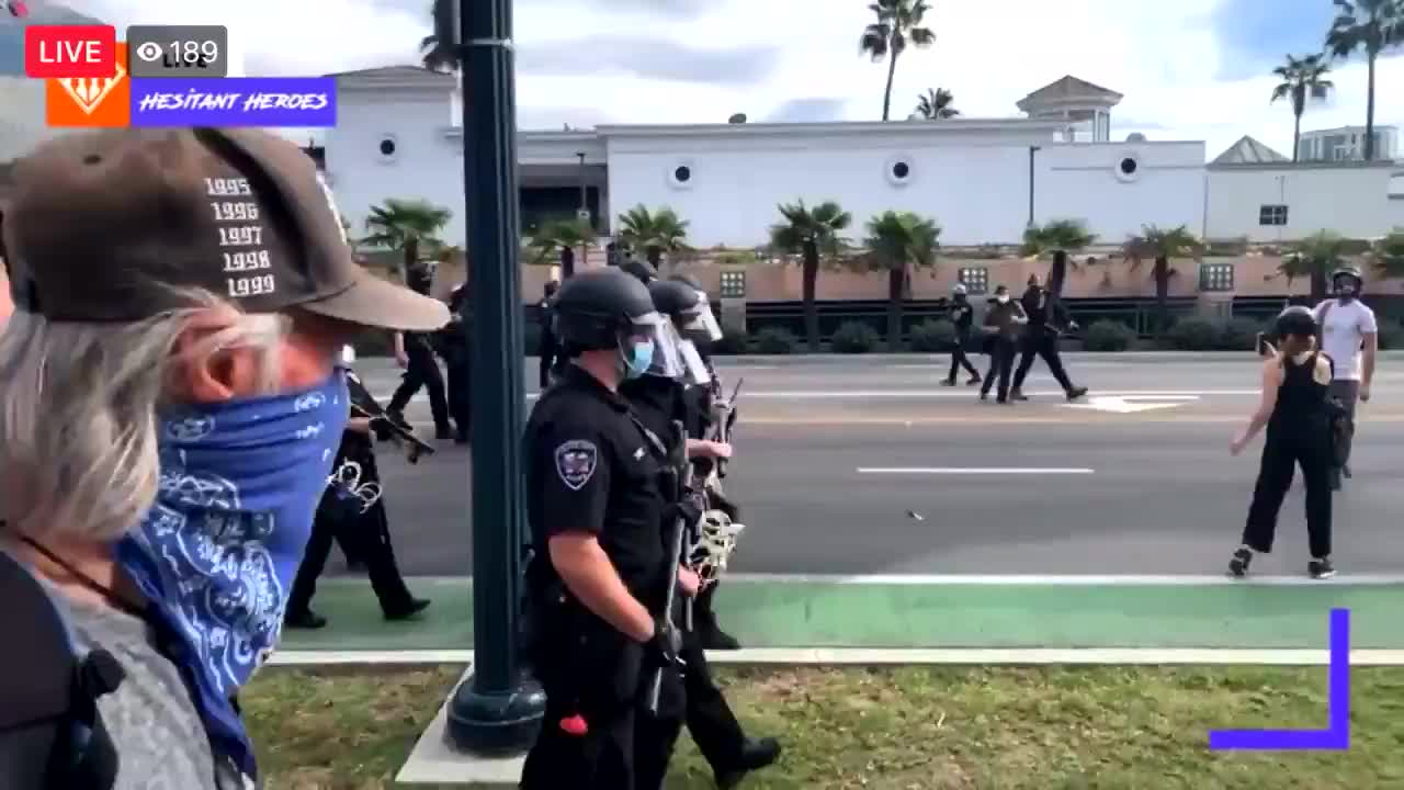 Beverly Hills. Antifa being forced back by the police.