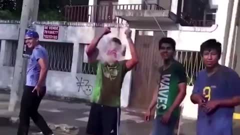 Funny slow motion water ballon explode on guy face