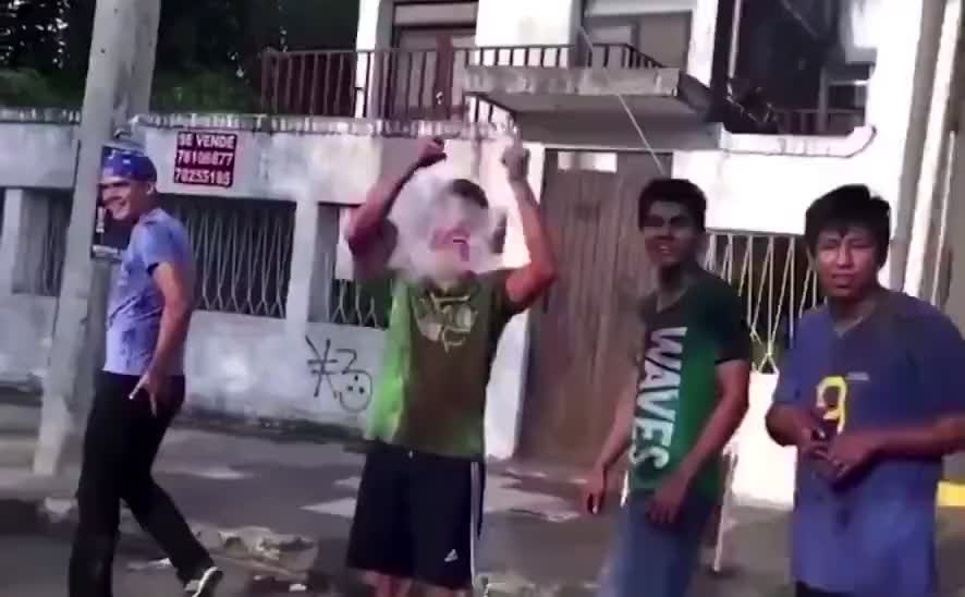 Funny slow motion water ballon explode on guy face