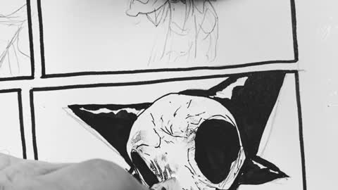 inking a comic book panel