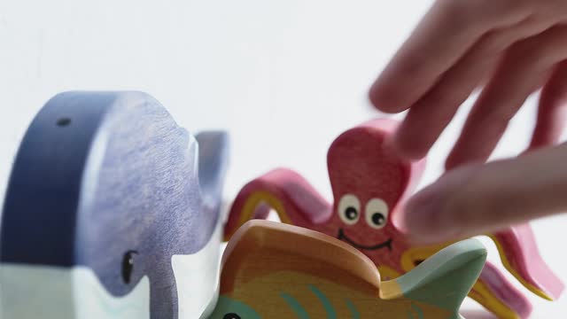 wooden-toy-animals-on-a-table