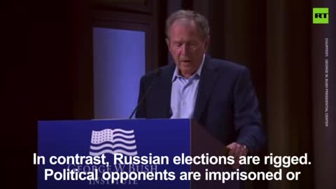 George W. Bush (Scherff) slips up and references IRAQ as full blown invasion by one man.