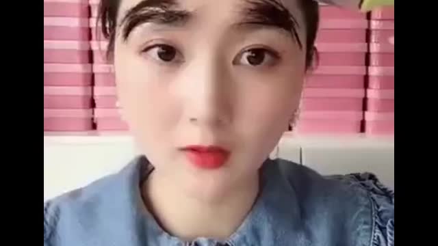 asian girl applying makeup