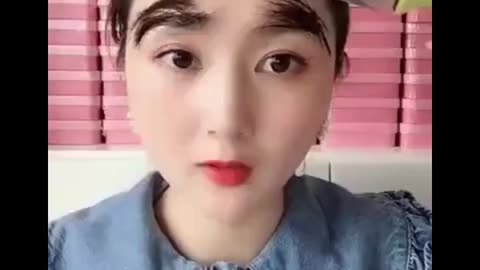 asian girl applying makeup