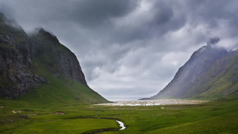 Foundational shot of the valley leading to the same horse beach in Lofoten, Norway