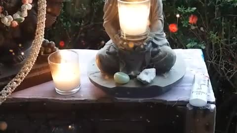 MALTI ON PORCH WITH BUDDHA