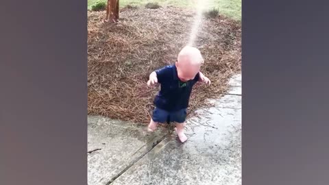 Funny Babies Playing With Water