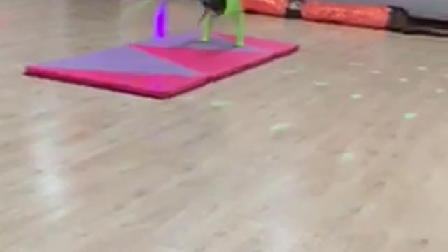 Neon green backflip purple foam pad falls on floor gymnastics girl