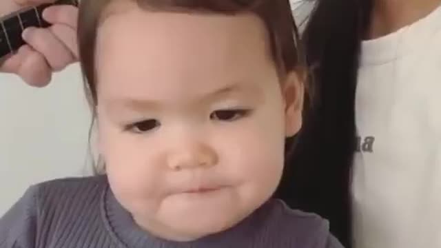 Baby collaborating with parents for singing song