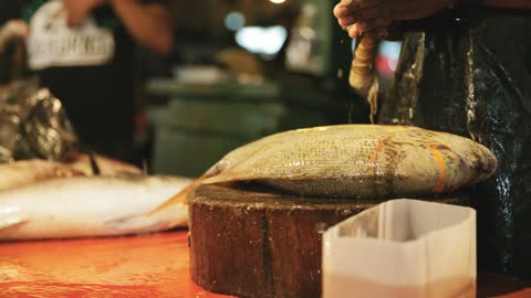 Cleaning Of Fish In The Market