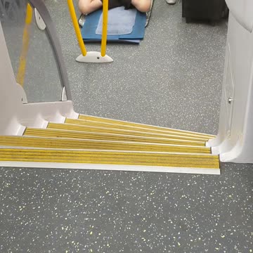Guy on blue yoga mat rolling on stomach