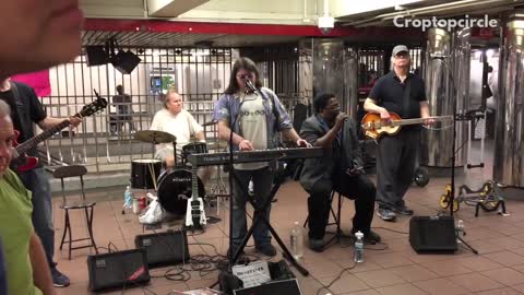 Band four people playing in subway