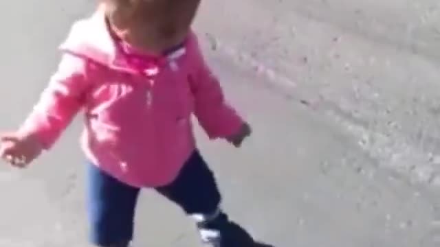 The little girl is fighting with her shadow