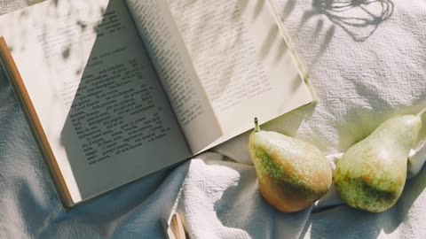 a-close-up-video-of-a-book-on-a-white-cloth