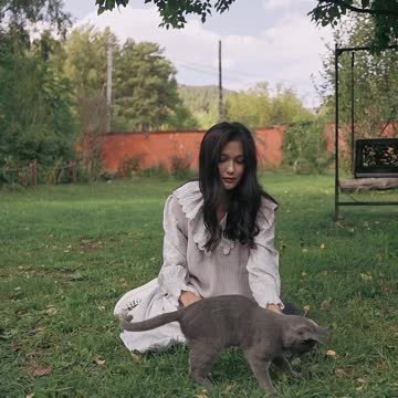 girl with animal in the field