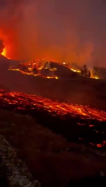 As night falls lava flows from the La Palma volcano 9-19-2021