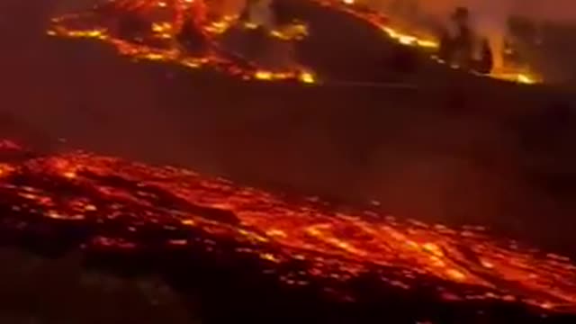 As night falls lava flows from the La Palma volcano 9-19-2021