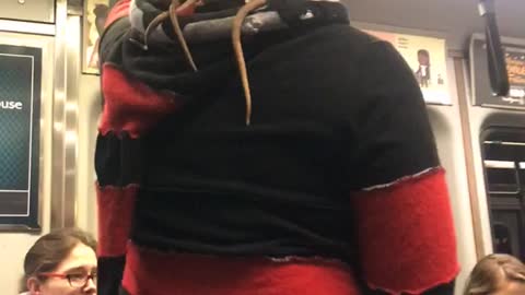 Guy black red jacket rats on back hood