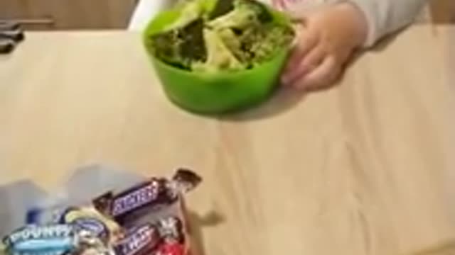 Little girl doesn't want candy only borccoli