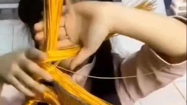Young girl professionally making dolls -1