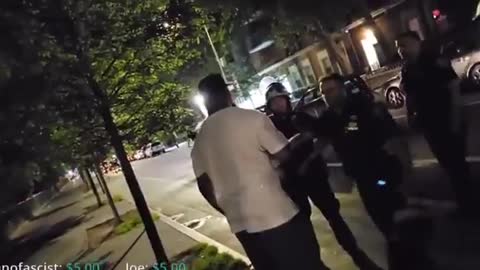 Black man repeatedly attacks an Asian police officer with racial slurs