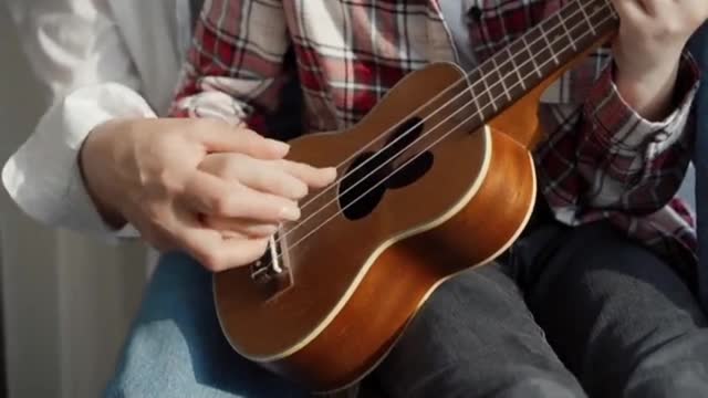 Cute baby playing the guitar