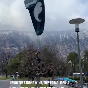 A paraglider's peculiar "hovering" takeoff technique.