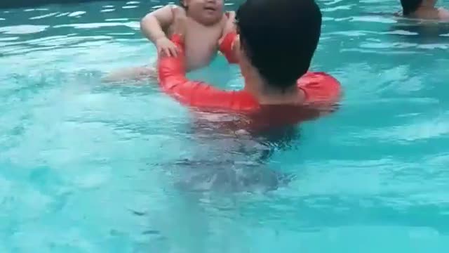 look how happy he is first bath in the pool