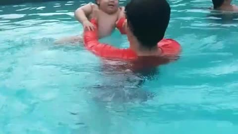 look how happy he is first bath in the pool