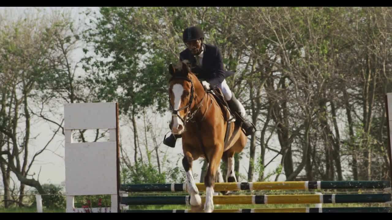 African American man riding his Dressage horse