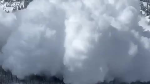 Skiers Watch Avalanche Barrel Toward Them