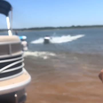 A Man NFL Blocks A Jetski